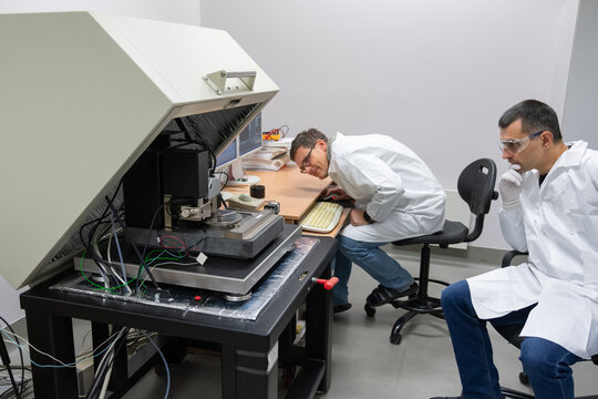 Researchers Working With Atomic Force Microscopy.
