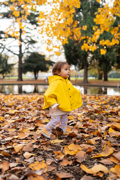 A little girl with her yellow jacket 