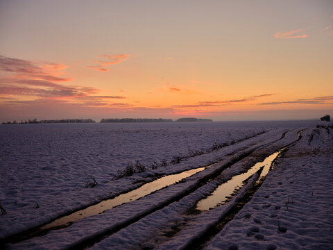winter landscape in the countryside and a dirt road
