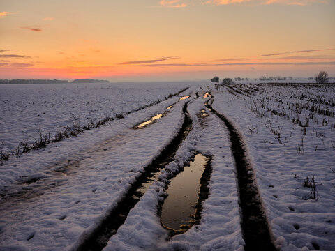 winter landscape in the countryside and a dirt road