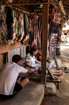 Traveler woman making traditional clothing