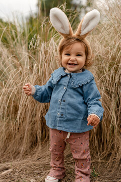 A little girl with bunny ears