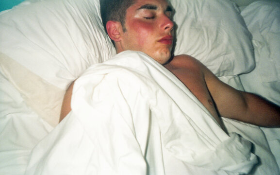 teenage boy asleep in bed