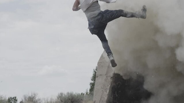 Explosion sending stunt man flying through the air in slow motion