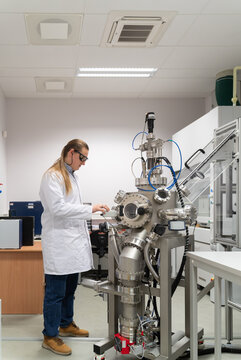 Scientist Working With Pulsed Laser Deposition System (PLD)