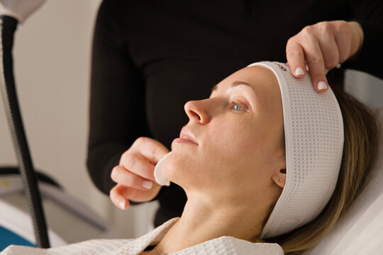 Cleaning the  face for a cosmetic procedures