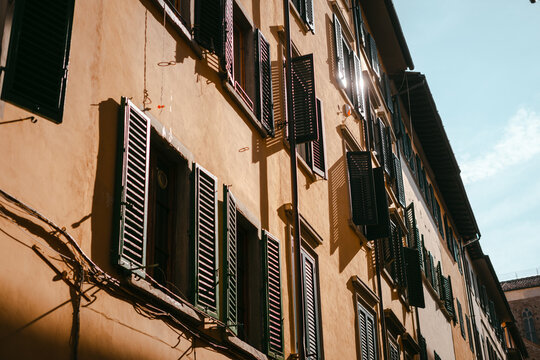 TRADITIONAL iTALIAN BULDING with wooden shutters on the windows