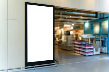 Mockup vertical blank billboard with black frame at front of shoes shop