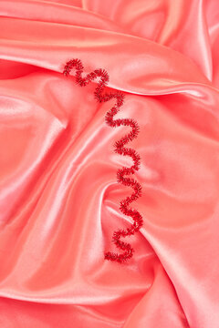 Whimsical Metallic Pipe Cleaner shape on satin
