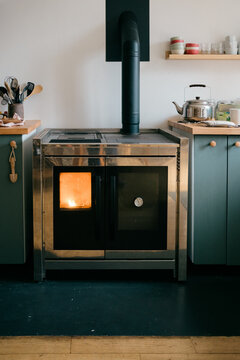 pellet stove in modern farmhouse kitchen 
