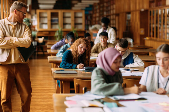 Professor supervising students 