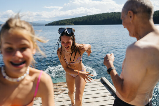Kids having fun swimming at the lake.
