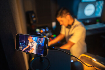 DJ recording a video