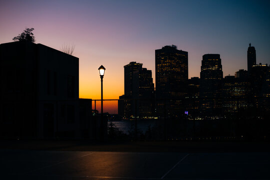 Sunset Silhouette of Urban Skyline