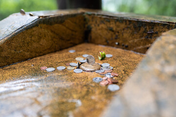 Close-up of offering coins.