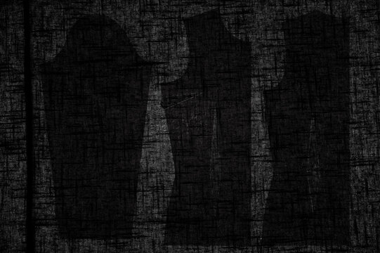 Pattern pieces on dark fabric with light shining through 