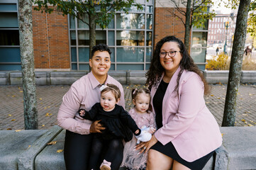 smiling happy mothers with their children on adoption day
