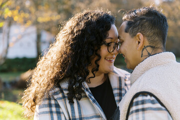 Married couple in love outdoors together in autumn