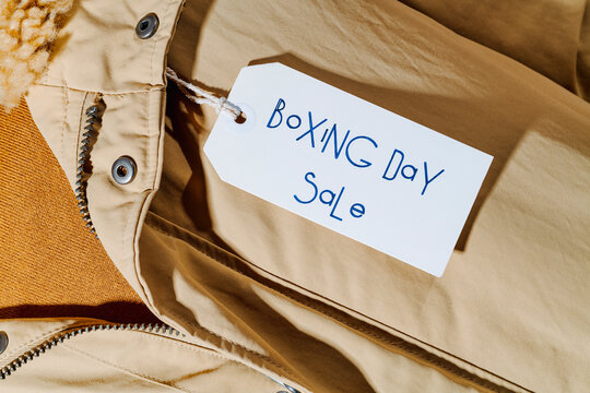 label with the text boxing day sale hanging from a coat