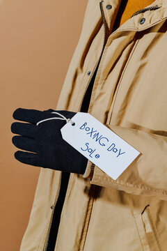 label with the text boxing day sale hanging from a glove