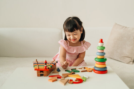 Child girl kid playing with sorter toys