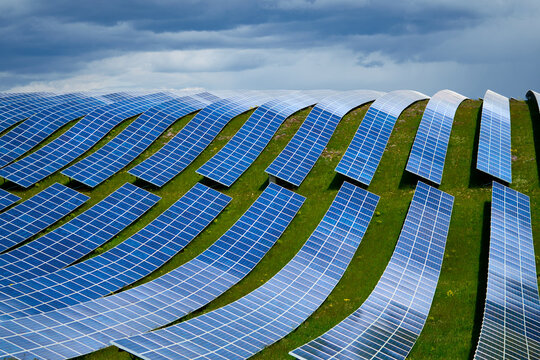 Large renewable energy solar park PV cells cover landscape 