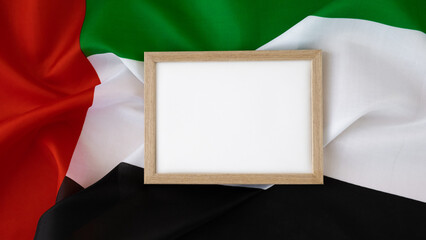 Empty white paper frame template National symbol of UAE. United Arab Emirates small flag with...