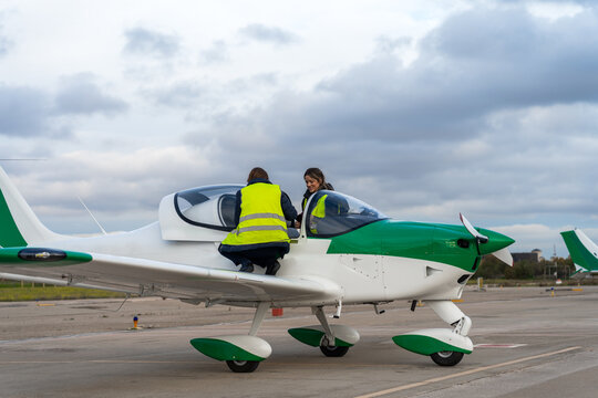 Airplane Crew Women Doing The Maintenance Before Flying.