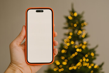 Hand of crop person showing smartphone with blank screen