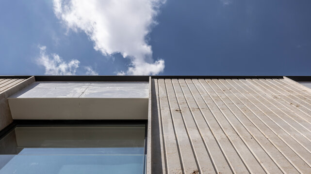 View from below of the facade of a modern and minimalistic house