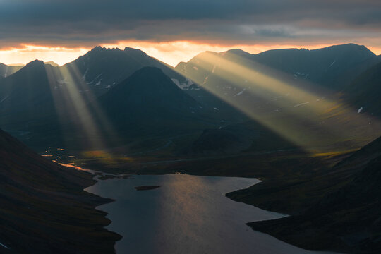 Sun rays over the mountain valley