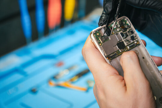 Man repairing a smartphone