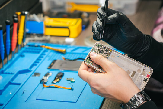 Man repairing a smartphone
