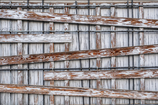 wooden wall with an irregular pattern of boards