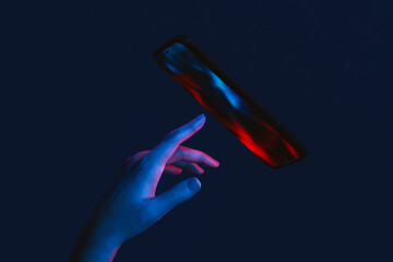 Hand touching the screen of a smartphone