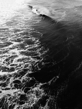 aerial photo of ocean waves breaking