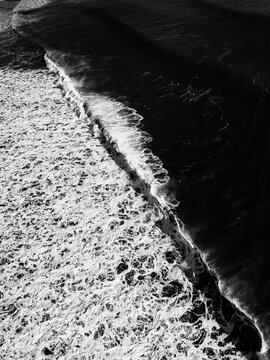 aerial drone photo of a wave, diagonal shoreline
