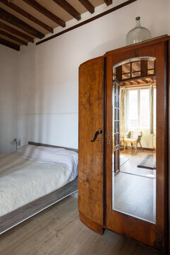 Interior design of French norman style bedroom with antique furniture