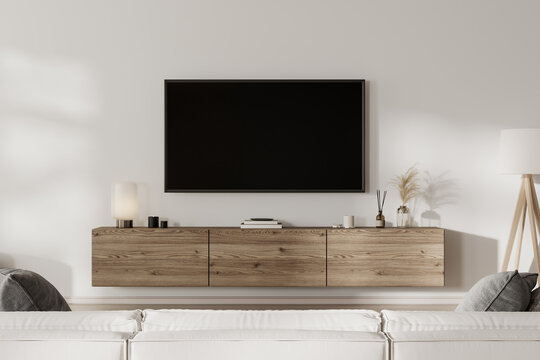Home interior with TV screen in front of sofa, 3d render
