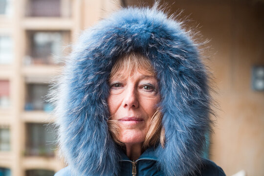 Mature woman covered with warm furry hood