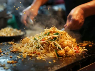 Fotobehang The perfect toss of Pad Thai a skill honed on the vibrant streets © WARIT_S