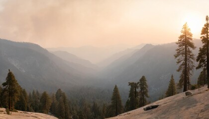 landscape in sequoia national park in sierra nevada mountains on a sunny day smoke from wildfires visible in the background covering the fresno area