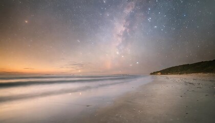ethereal view of a beach and milky way