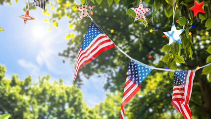 American flags and star decorations amidst green leaves against a blue sky