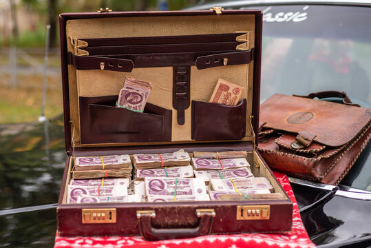 A suitcase full of old Soviet money. Vintage. Retro. Banknotes with the image of V.I. Lenin. Banknotes of the USSR.