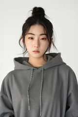 Close-up of a Pretty Young Korean Super Model in Athleisure Wear, sporting a Hoodie and Leggings, exuding casual-cool vibes with a confident pose. photo on white isolated background