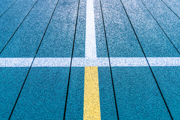 Elevated Platform Tennis, Paddle Ball courts with yellow pickelball lines.  Floor surface is green with white and yellow 
 - obrazy, fototapety, plakaty