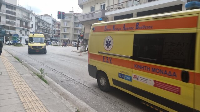 abulance on the road moving fast in greece