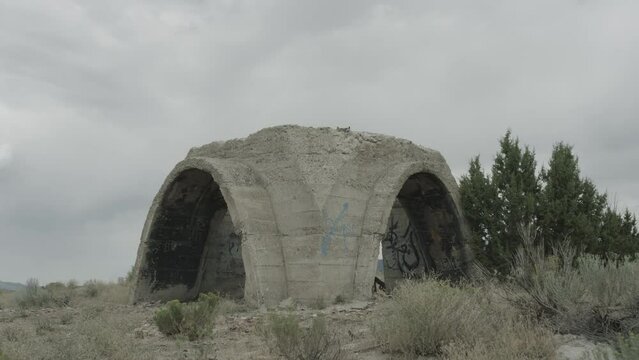Cinematic explosion in old cement structure - tilt up with fire ball