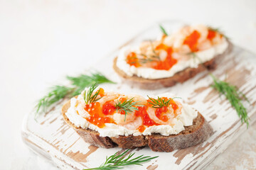 Toast skagen - shrimps and red caviar on bread. Classic swedish sandwich.